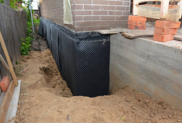 SJ Waterproofing Pros technician performing targeted Emergency Waterproofing assessment in Longport, NJ